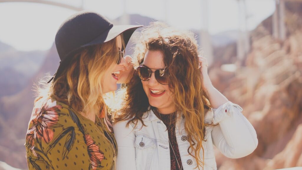 two women laughing in the sunshine