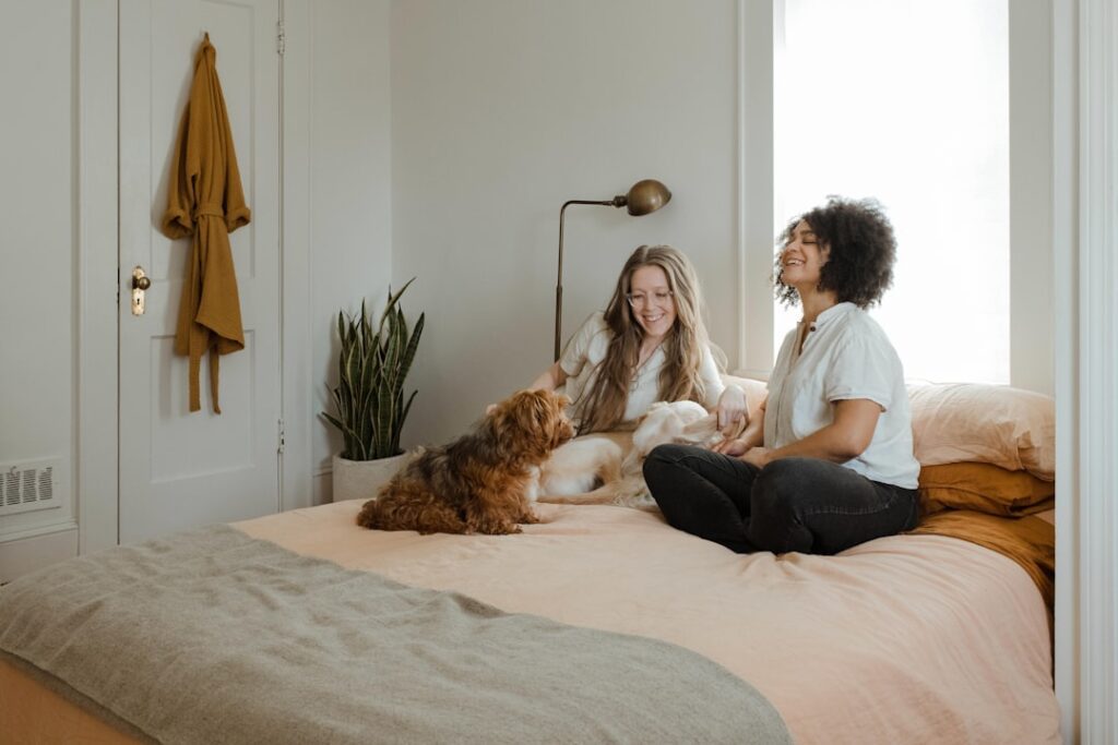 Couple on bed with dogs