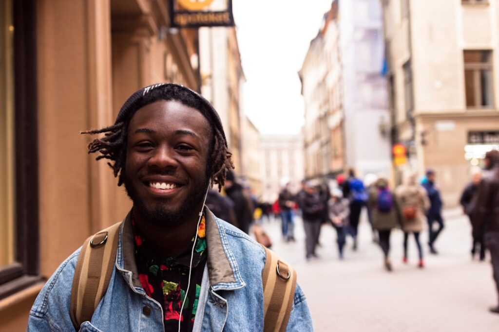 black teenager smiling in downtown city
