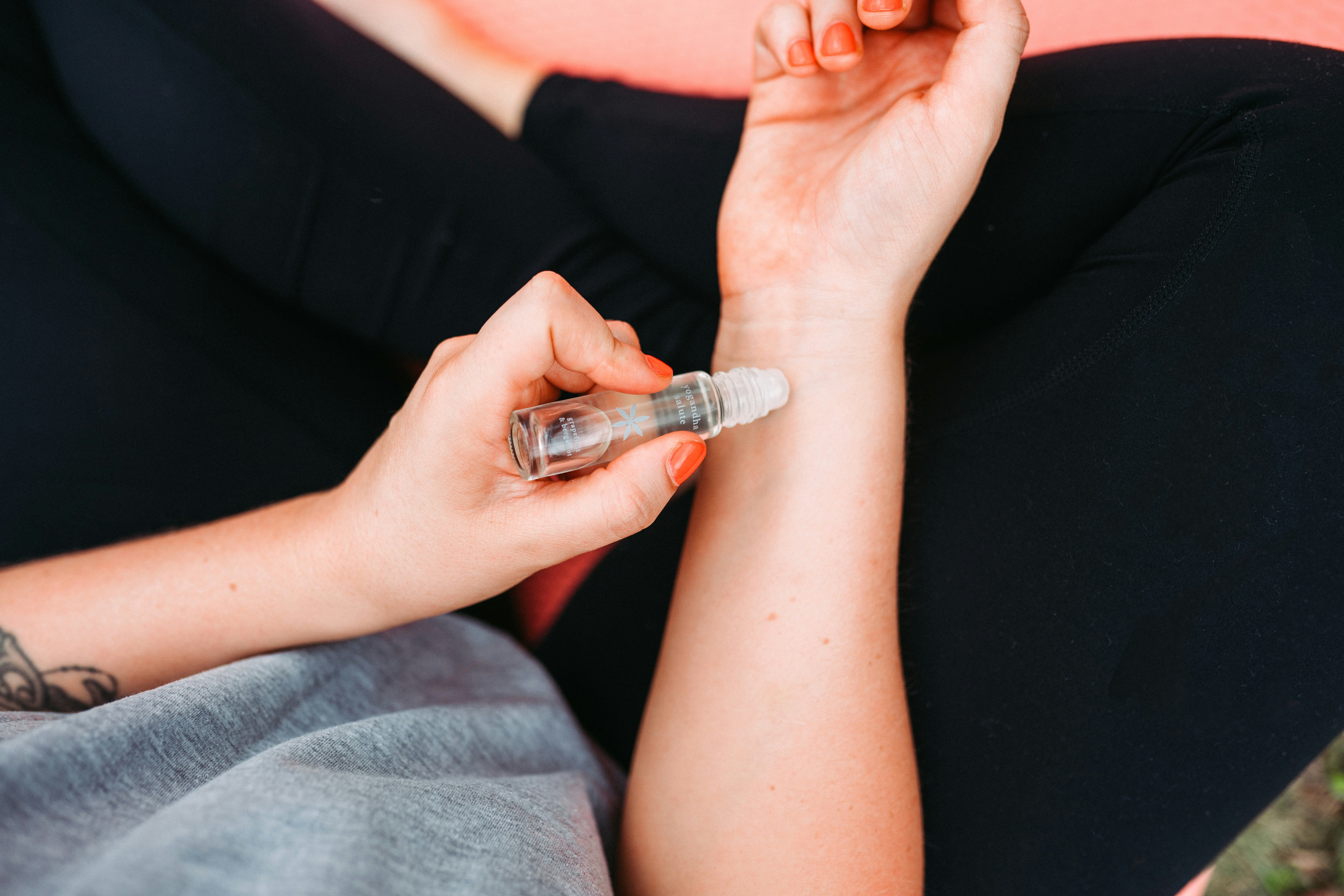 Using essential oil roller on wrist for OCD relief, practical aromatherapy for calm and focus