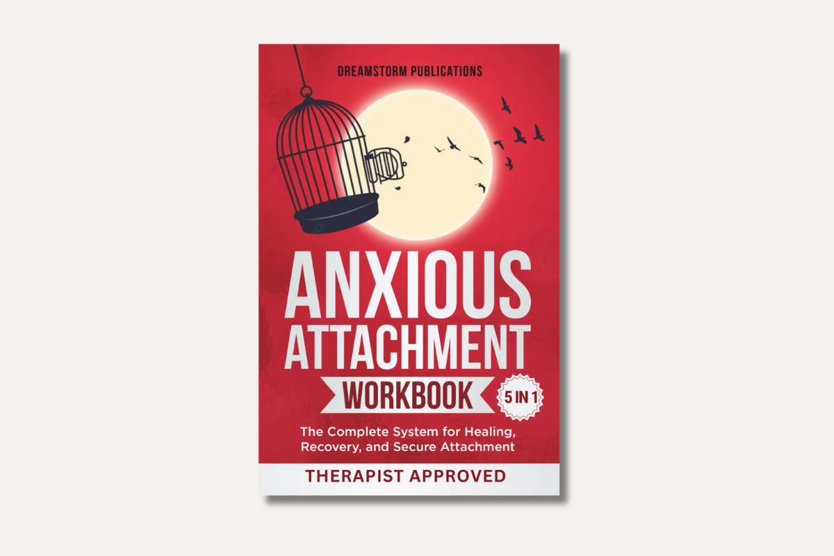 Book cover of ‘Anxious Attachment Workbook’ by Dreamstorm Publications — red cover with an open birdcage symbolizing freedom and healing from anxious attachment