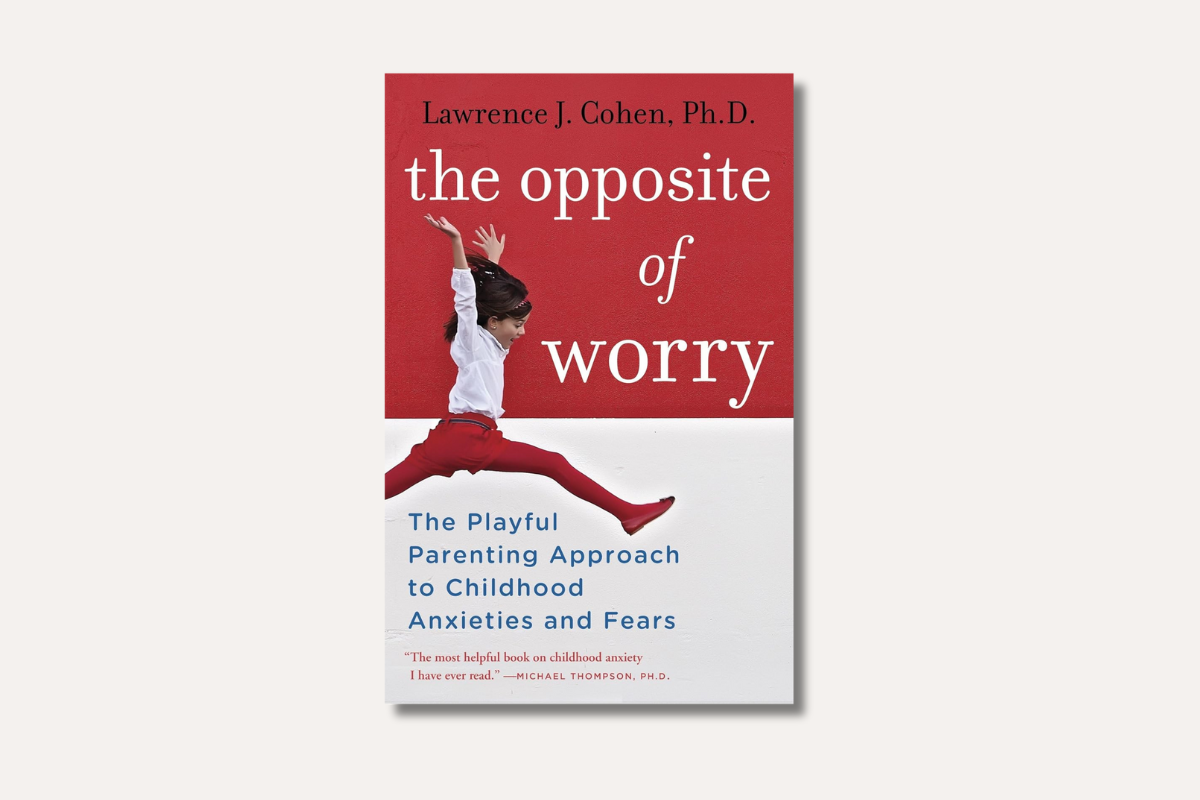 Book cover of "The Opposite of Worry" by Lawrence J. Cohen, showing a joyful child leaping in midair against a red and white background