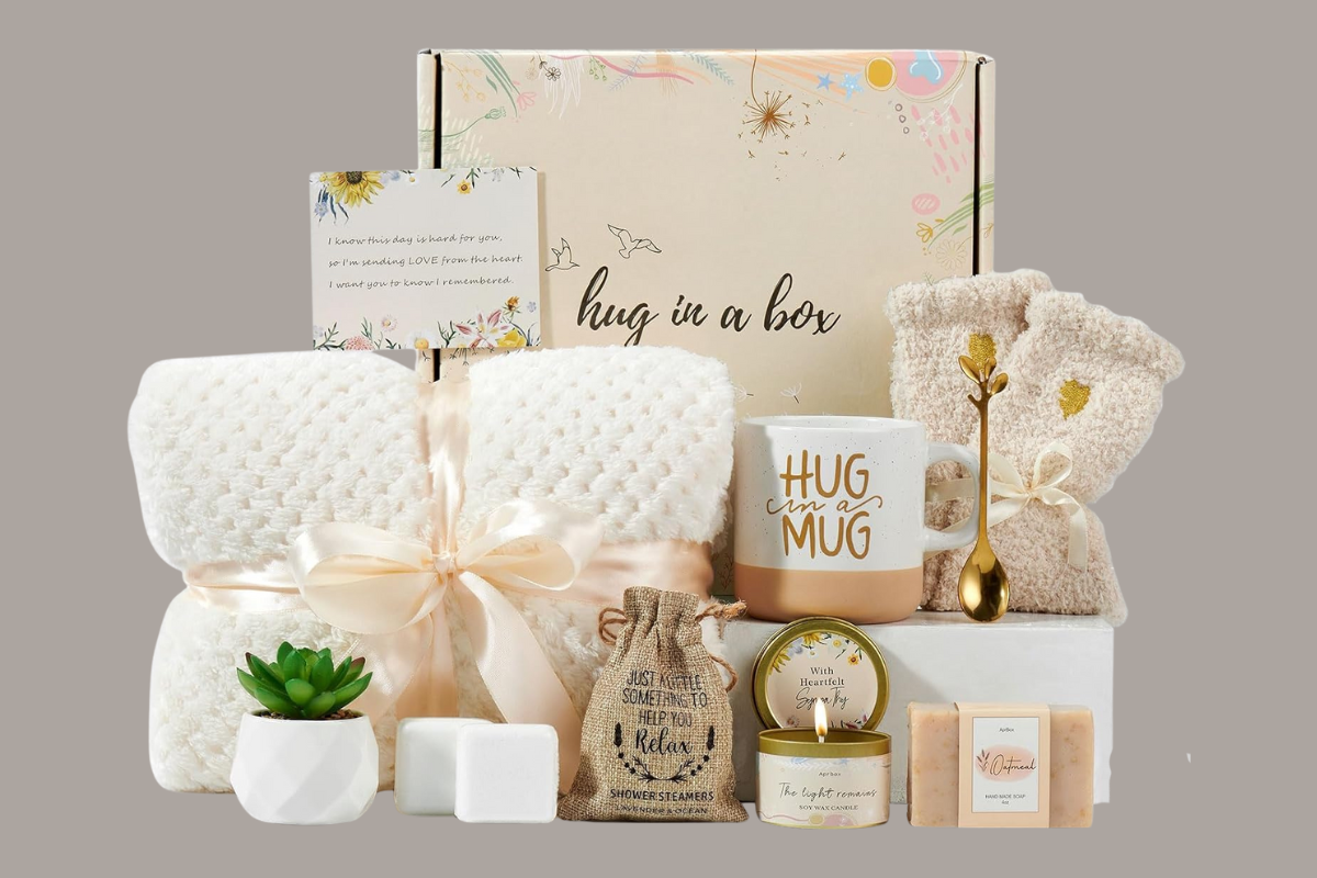 Hug in a Box sympathy gift set with blanket, mug, candle, and cozy items — a thoughtful care package for a grieving mother