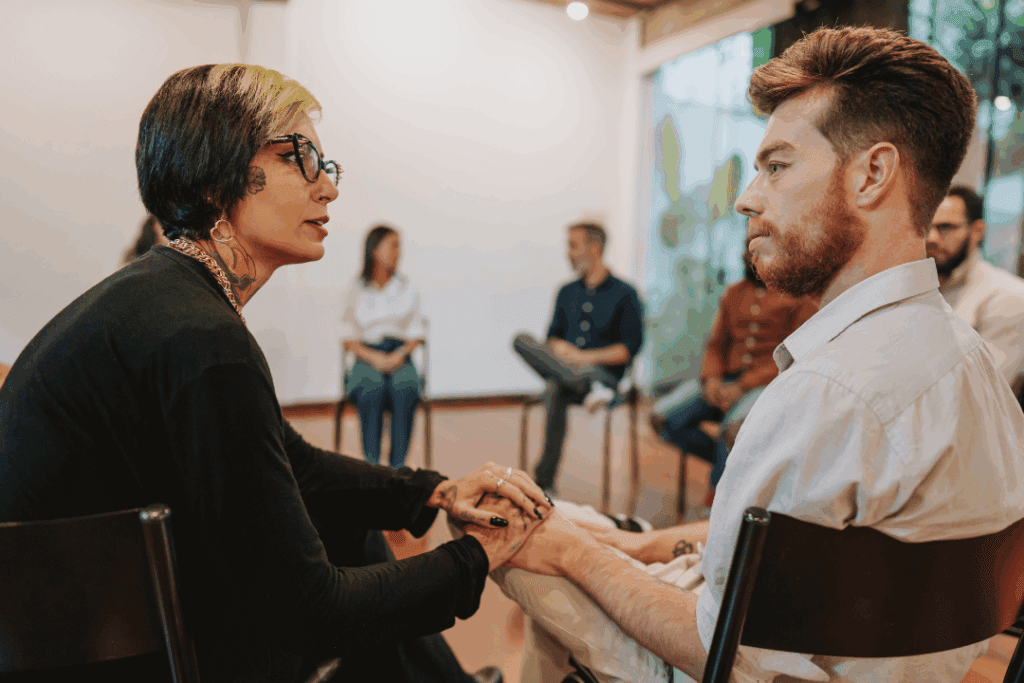 A therapist helping the man uncover his hidden emotions, in order to properly expressed his self. 