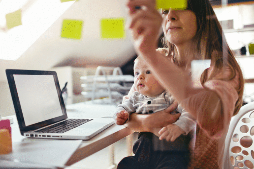 A mom sitting in a chair, stress with all the workloads and at the same time, baby sitting her child. 